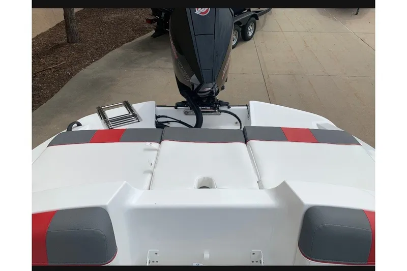 Slide: The Image of 2027 Tahoe T21 boat rear view with motor, featuring sleek design and modern aesthetics. - 9