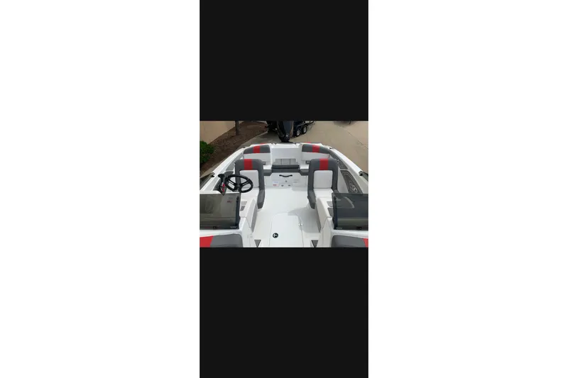 Slide: The Image of 2027 Tahoe T21 boat interior with modern seating and steering wheel. - 7