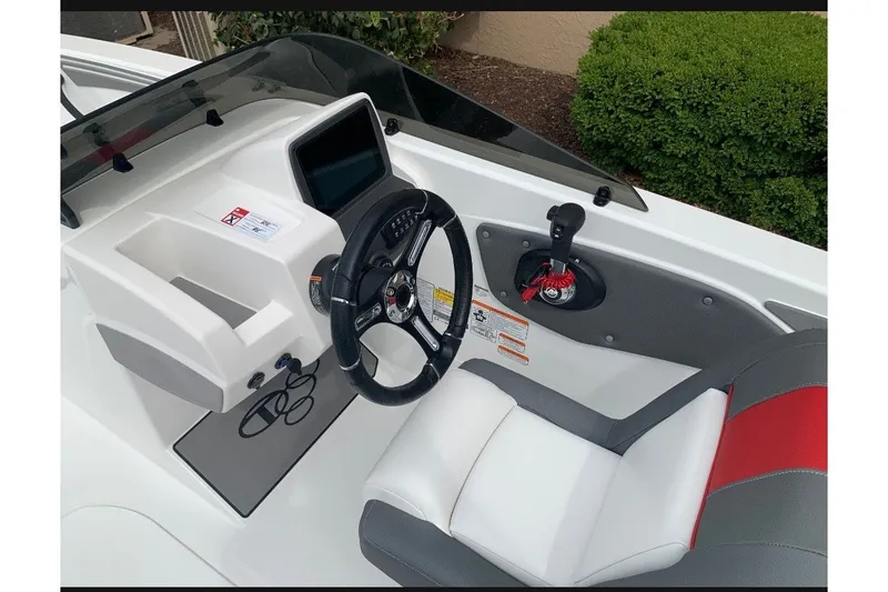 Slide: The Image of Cockpit of 2027 Tahoe T21 boat with steering wheel and control panel. - 5