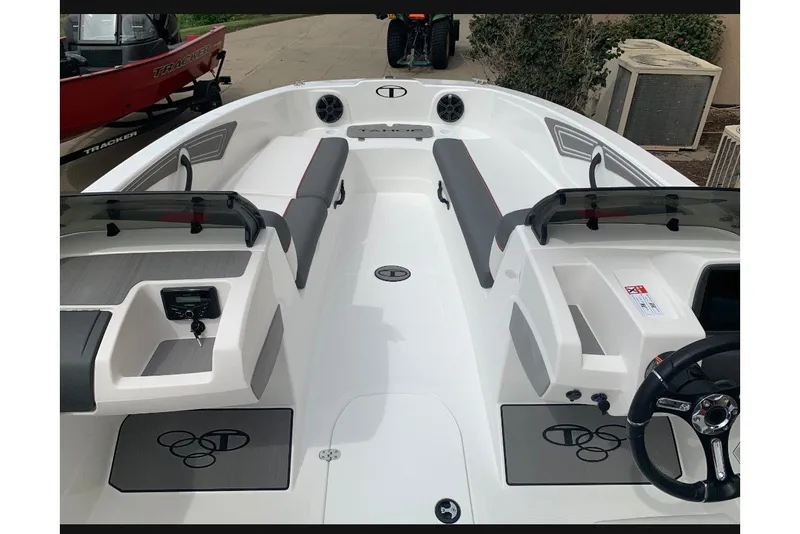Slide: The Image of 2027 Tahoe T21 boat interior with seating and steering wheel, showcasing modern design. - 10