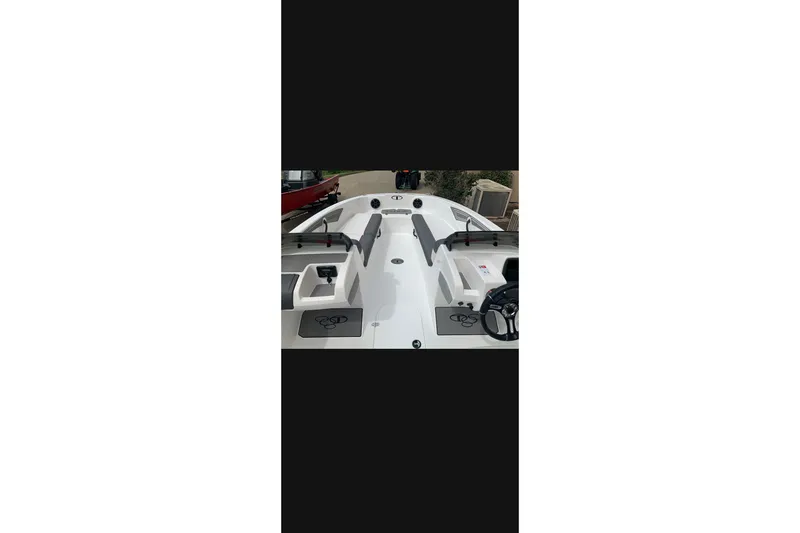 Slide: The Image of 2027 Tahoe T21 boat interior with seating and steering wheel, showcasing modern design. - 9