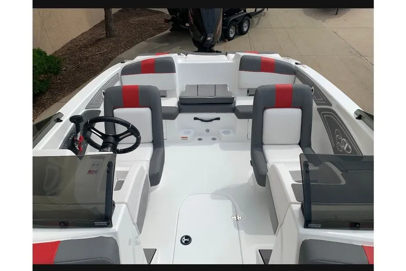 Slide: The Image of 2027 Tahoe T21 boat interior with modern seating and steering wheel. - 8