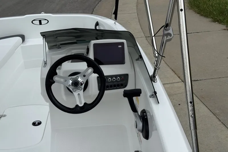 Slide: The Image of Steering console of 2027 Tahoe T16 boat with modern controls and display. - 14