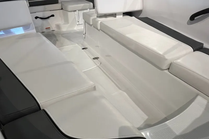 Slide: The Image of Interior seating of 2027 Tahoe T16 boat, featuring white cushioned benches. - 12
