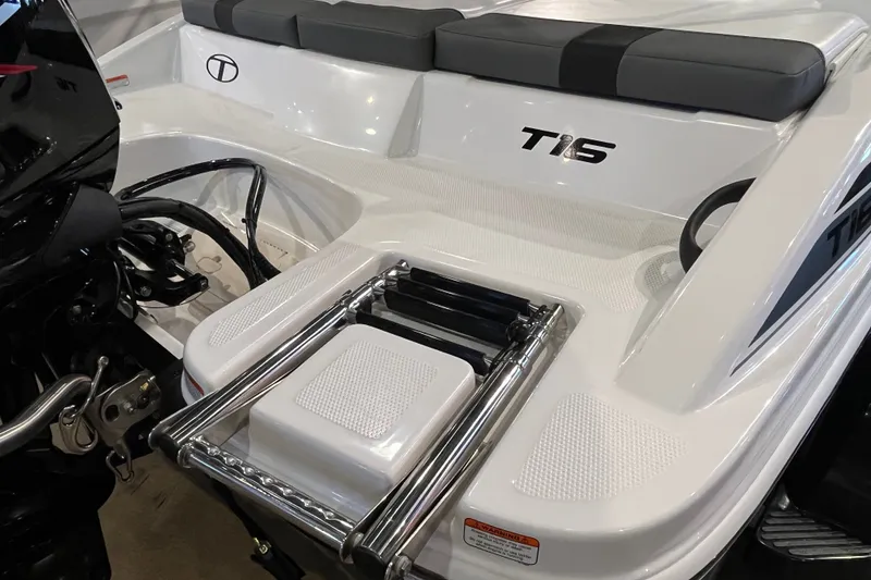 Slide: The Image of 2027 Tahoe T16 boat with sleek design and integrated swim platform ladder. - 6