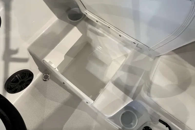 Slide: The Image of Interior view of 2027 Tahoe T16 boat with storage compartment and speaker. - 26