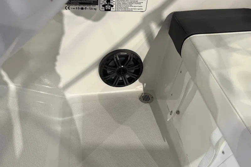 Slide: The Image of Interior of 2027 Tahoe T16 boat featuring speaker and seating area. - 33