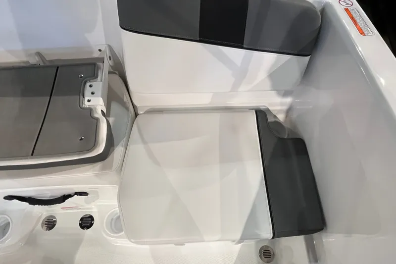Slide: The Image of Interior seating of 2027 Tahoe T16 boat, featuring gray and white upholstery. - 22