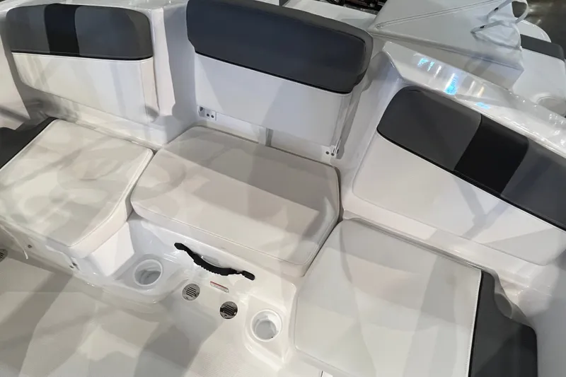 Slide: The Image of 2027 Tahoe T16 boat interior with cushioned seating and cup holders. - 20