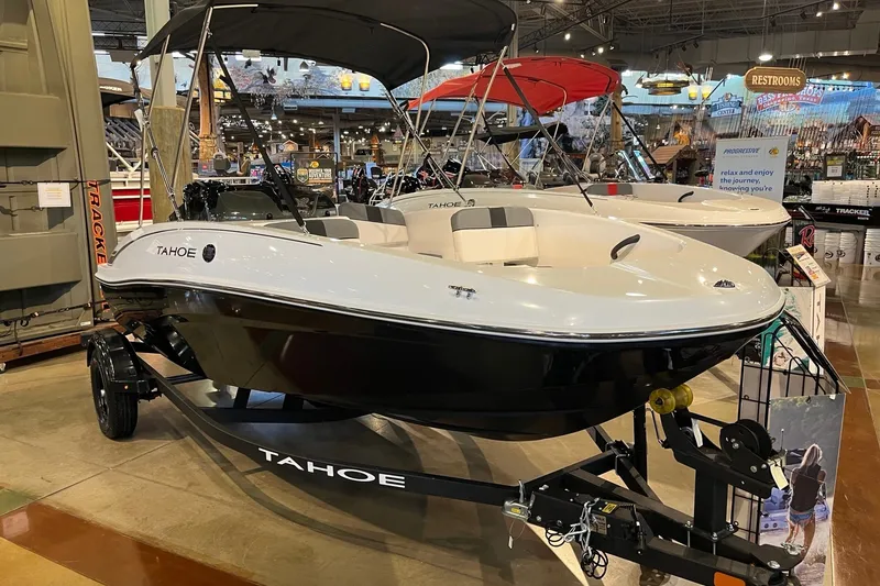 The Image of 2027 Tahoe T16 boat on display in a showroom, featuring sleek design and modern amenities. - 0