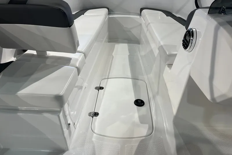 Slide: The Image of Interior view of 2027 Tahoe T16 boat, featuring sleek white seating and storage compartment. - 27