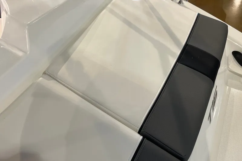 Slide: The Image of 2027 Tahoe T16 boat seat with white and black upholstery. - 18