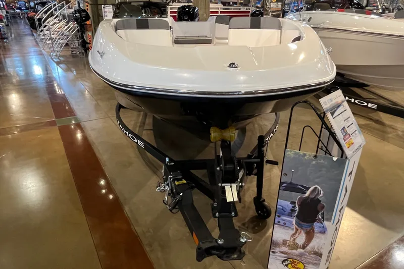 Slide: The Image of 2027 Tahoe T16 boat displayed in showroom, featuring sleek design and modern features. - 7