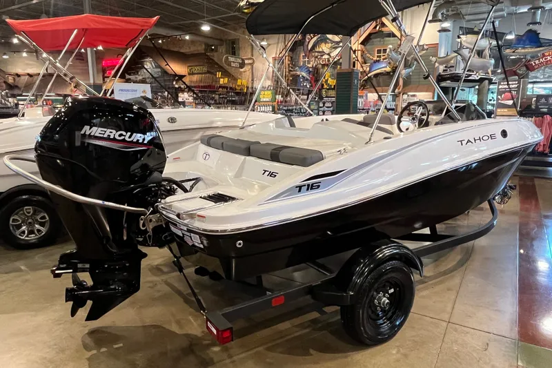 Slide: The Image of 2027 Tahoe T16 boat with Mercury engine displayed indoors. - 5