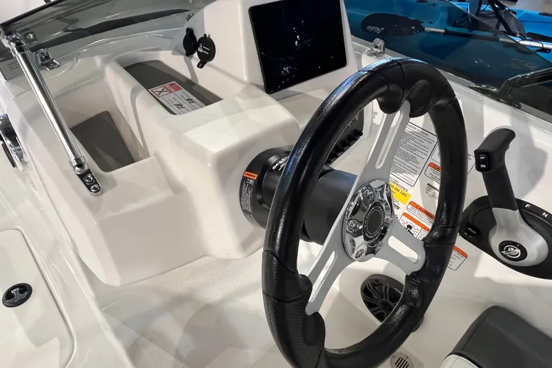 Slide: The Image of Steering console of 2027 Tahoe T16 boat with modern controls and sleek design. - 11