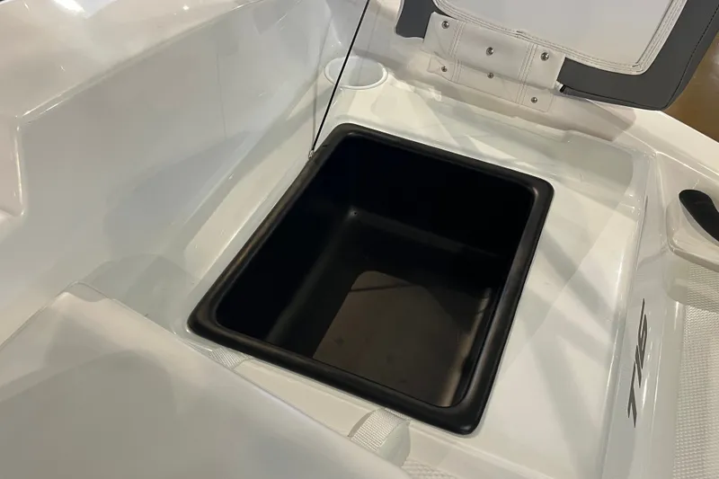 Slide: The Image of Open storage compartment in 2027 Tahoe T16 boat, featuring sleek white interior design. - 19