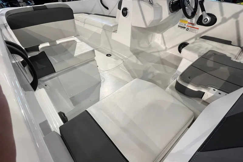 Slide: The Image of Interior of a 2027 Tahoe T16 boat featuring sleek seating and modern design elements. - 13