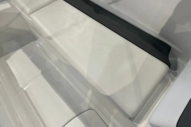 Slide: The Image of White seating area in a 2027 Tahoe T16 boat interior. - 30