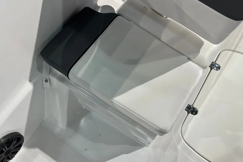 Slide: The Image of 2027 Tahoe T16 boat interior with cushioned seating and storage compartment. - 28