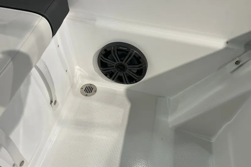 Slide: The Image of Interior of 2027 Tahoe T16 boat featuring speaker and drain on white surface. - 34