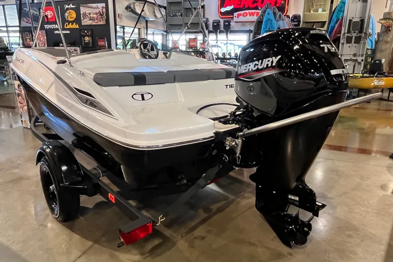 Slide: The Image of 2027 Tahoe T16 boat with Mercury outboard motor displayed indoors. - 4