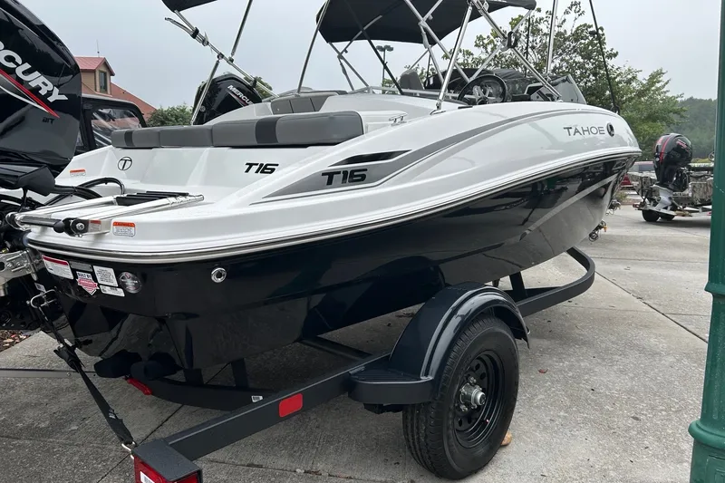 Slide: The Image of 2027 Tahoe T16 boat on trailer, featuring sleek design and Mercury engine. - 4