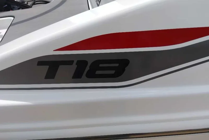 Slide: The Image of 2027 Tahoe T18 boat logo with red and gray accents. - 11