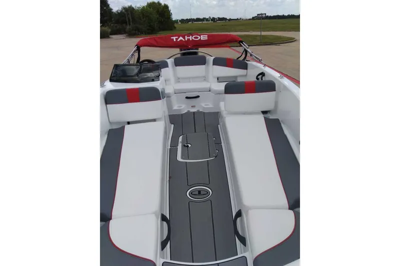 Slide: The Image of 2027 Tahoe T18 boat interior with gray and red seating, sleek design. - 4