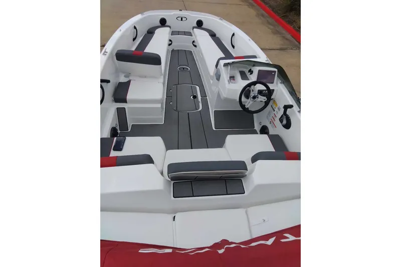 Slide: The Image of 2027 Tahoe T18 boat interior with modern seating and steering console. - 5