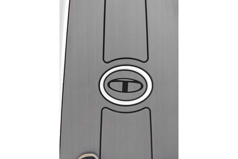 Slide: The Image of Close-up of 2027 Tahoe T18 logo on a sleek, metallic surface. - 7