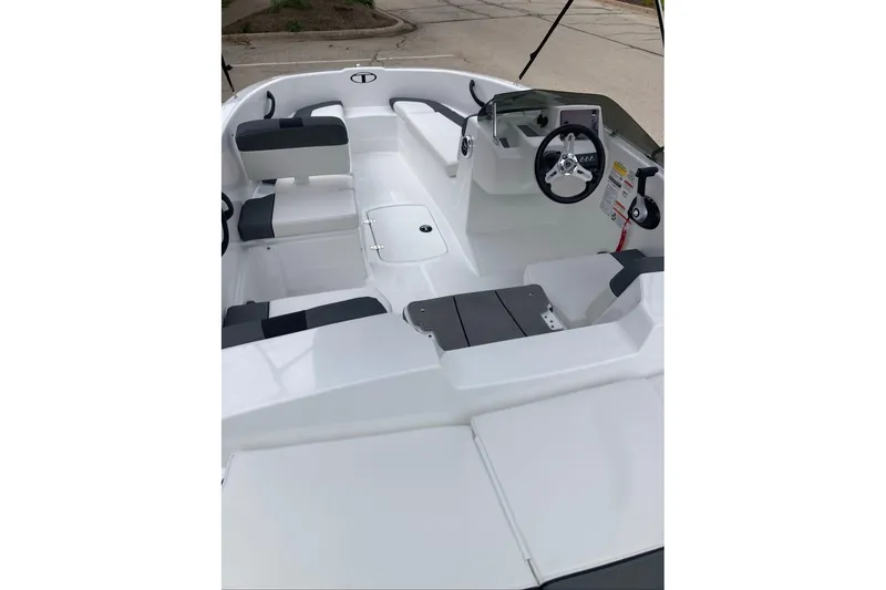 Slide: The Image of Interior view of a 2027 Tahoe T16 boat, featuring sleek seating and a modern steering console. - 5