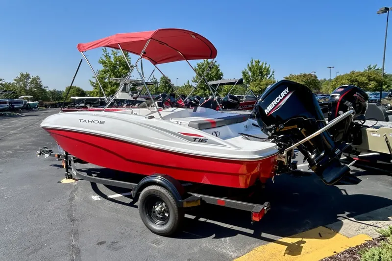 Slide: The Image of 2027 Tahoe T16 boat with red canopy and Mercury outboard motor on trailer. - 1