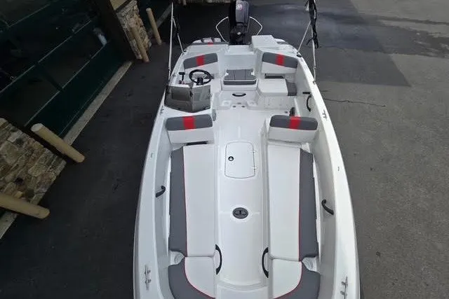 Slide: The Image of 2027 Tahoe T18 boat with gray and red seating, viewed from above. - 5