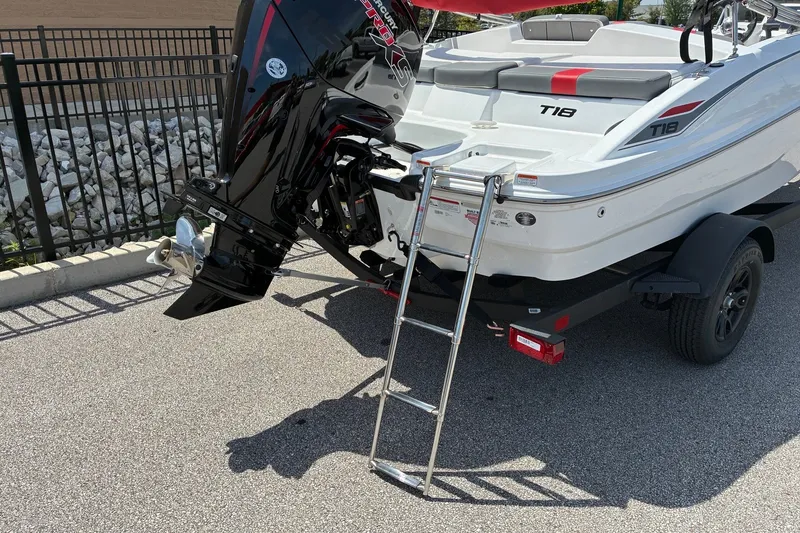 Slide: The Image of 2027 Tahoe T18 boat with outboard motor and ladder on trailer. - 8