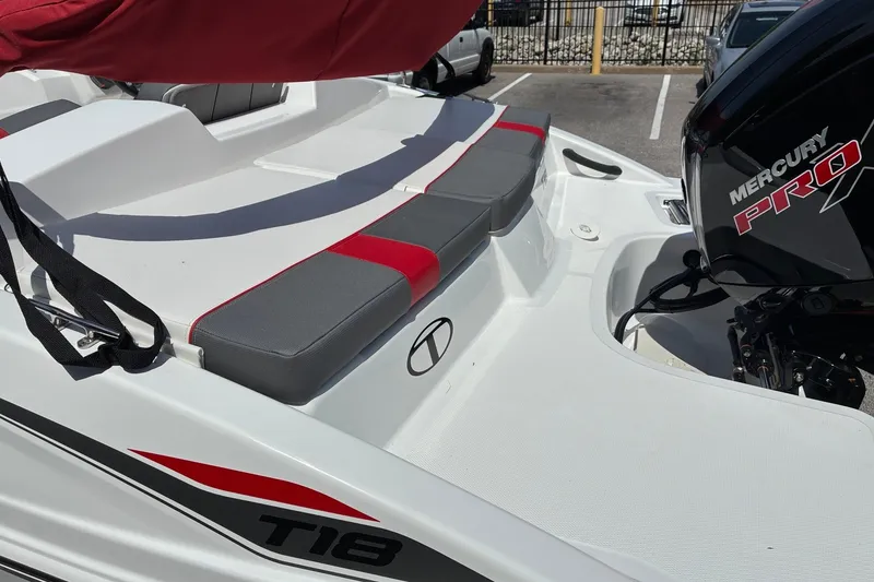 Slide: The Image of 2027 Tahoe T18 boat with Mercury Pro motor, featuring red and gray seating. - 7