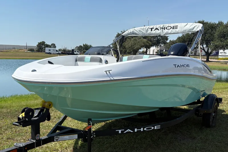The Image of 2027 Tahoe T16 boat on trailer by a lake, sunny day. - 0