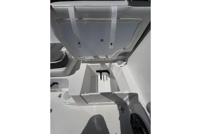 Slide: The Image of 2027 Tahoe T16 boat storage compartment with open lid, showcasing interior space. - 14
