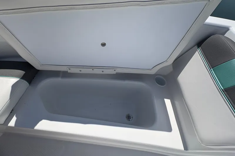 Slide: The Image of 2027 Tahoe T16 boat storage compartment with open lid, showcasing interior space. - 13