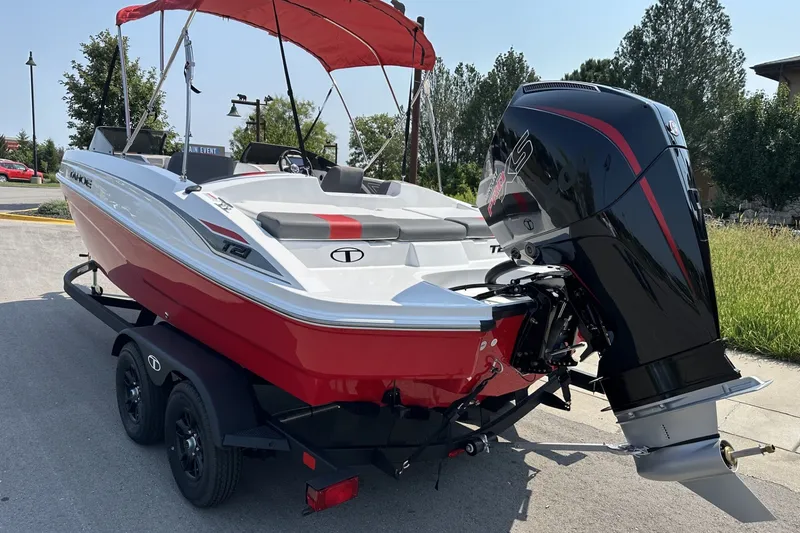 Slide: The Image of Red and white 2027 Tahoe T21 boat with outboard motor on a trailer. - 3