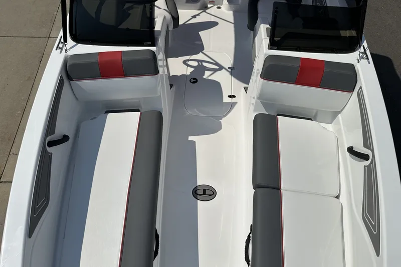 Slide: The Image of 2027 Tahoe T21 boat interior with gray and red seating, sleek design. - 12