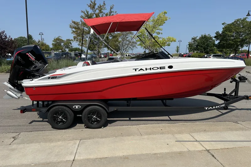 Slide: The Image of 2027 Tahoe T21 boat with red hull and canopy on a trailer. - 6