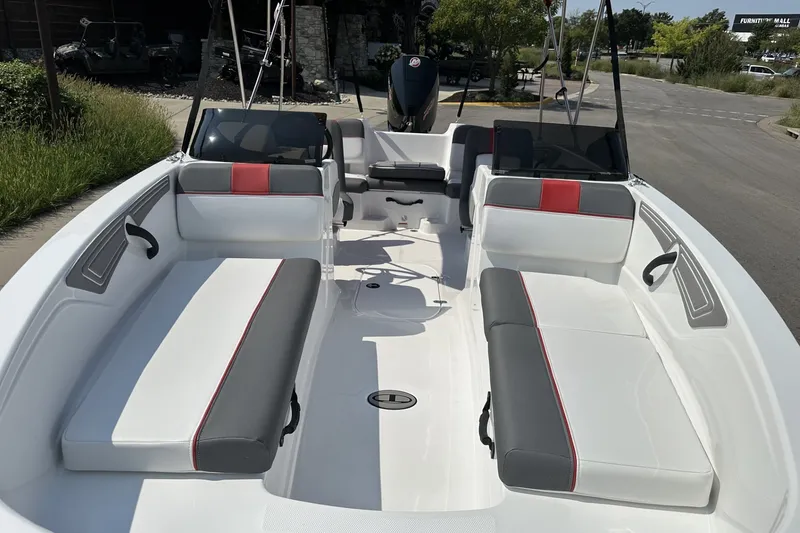 Slide: The Image of 2027 Tahoe T21 boat interior with white and gray seating, red accents, and modern design. - 11
