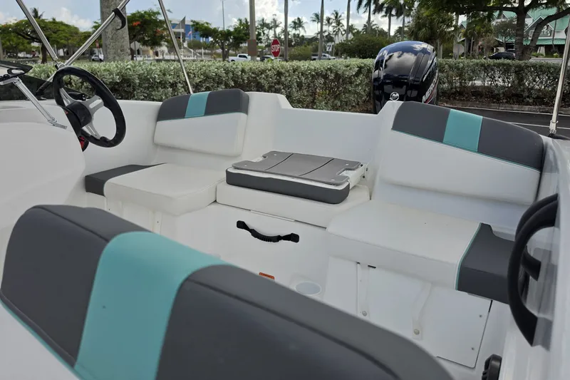 Slide: The Image of Interior of 2027 Tahoe T16 boat with modern seating and steering wheel. - 4