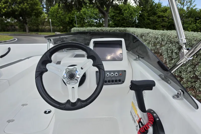 Slide: The Image of Steering console of 2027 Tahoe T16 boat with modern controls and display. - 6