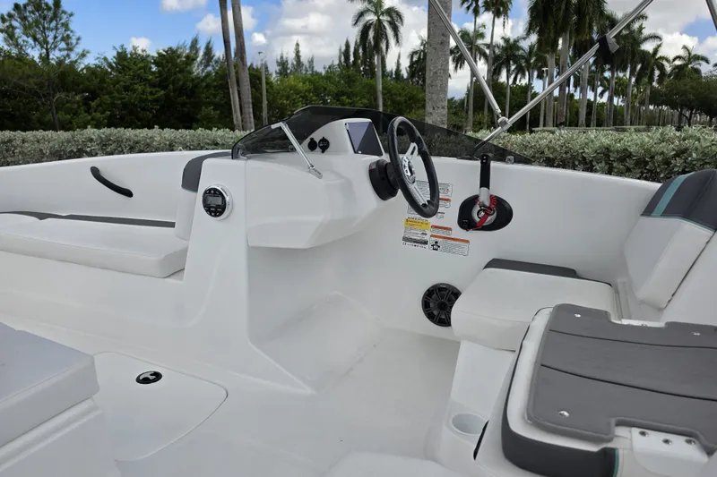 Slide: The Image of 2027 Tahoe T16 boat interior with steering wheel, seating, and dashboard controls. - 5