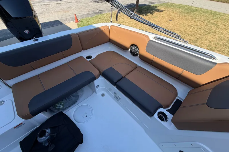 Slide: The Image of 2027 Tahoe 1950 boat interior with brown and black seating, showcasing modern design. - 13