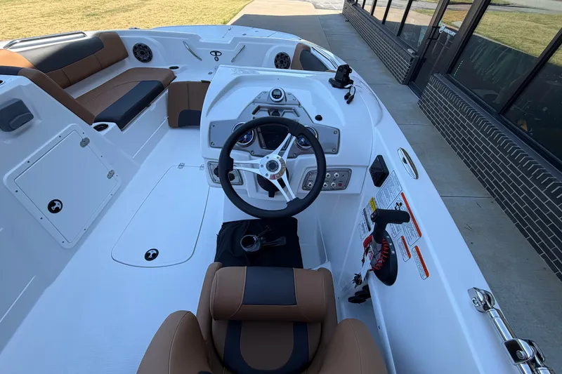Slide: The Image of Interior view of a 2027 Tahoe 1950 boat, featuring a sleek steering console and comfortable seating. - 14