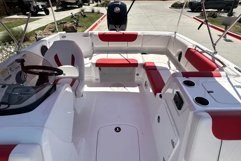 Slide: The Image of Modern 2027 Tahoe 1950 boat interior with red and white seating, steering wheel, and cup holders. - 15