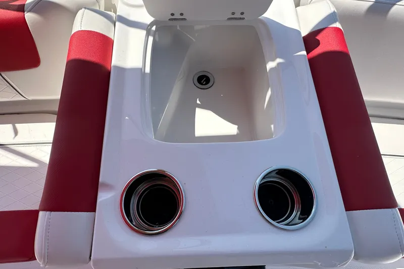 Slide: The Image of Tahoe 1950 boat interior with red accents and dual cup holders, 2027 model. - 14