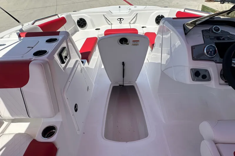 Slide: The Image of Interior of 2027 Tahoe 1950 boat with red and white seating and storage compartments. - 17